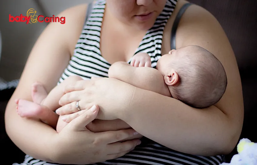 How to hold a newborn baby